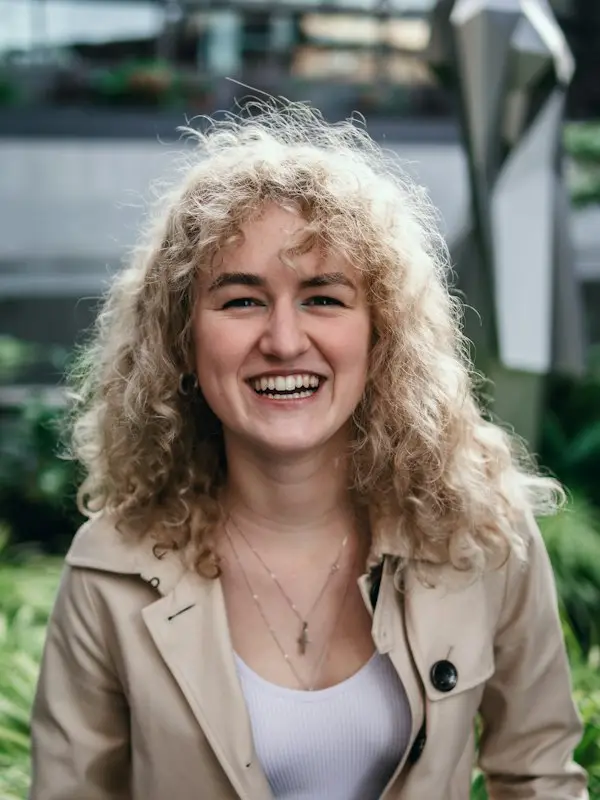Woman with blonde curls laughing
