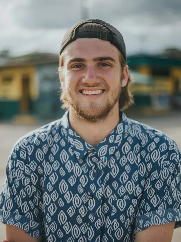 Smiling man in a patterned shirt in Ecuador